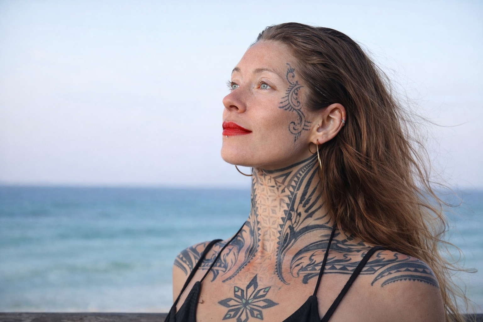 Kera Lynn, Co-Founder of Aura, by the ocean at golden hour